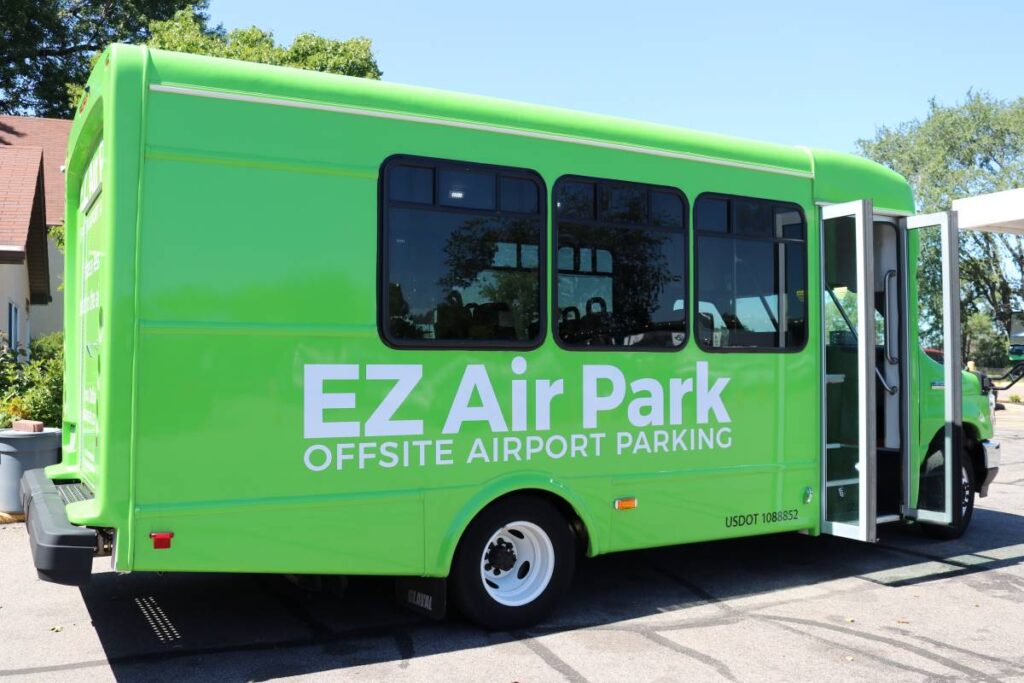 Green airport shuttle bus with the text 