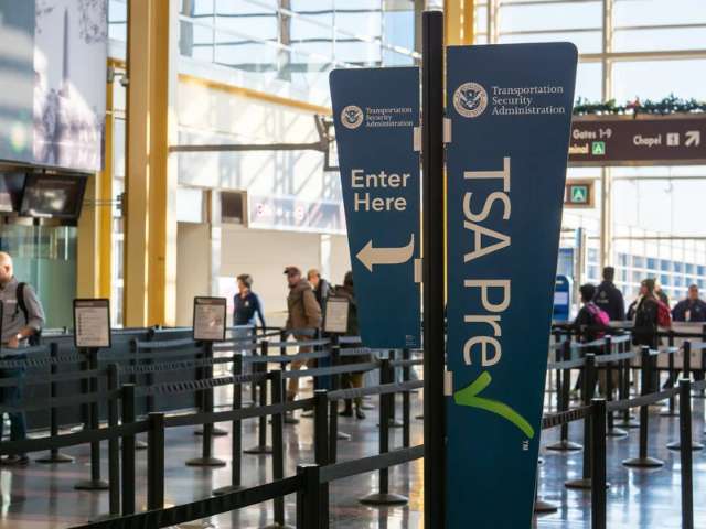 Airport security checkpoint   sign for TSA PreCheck.